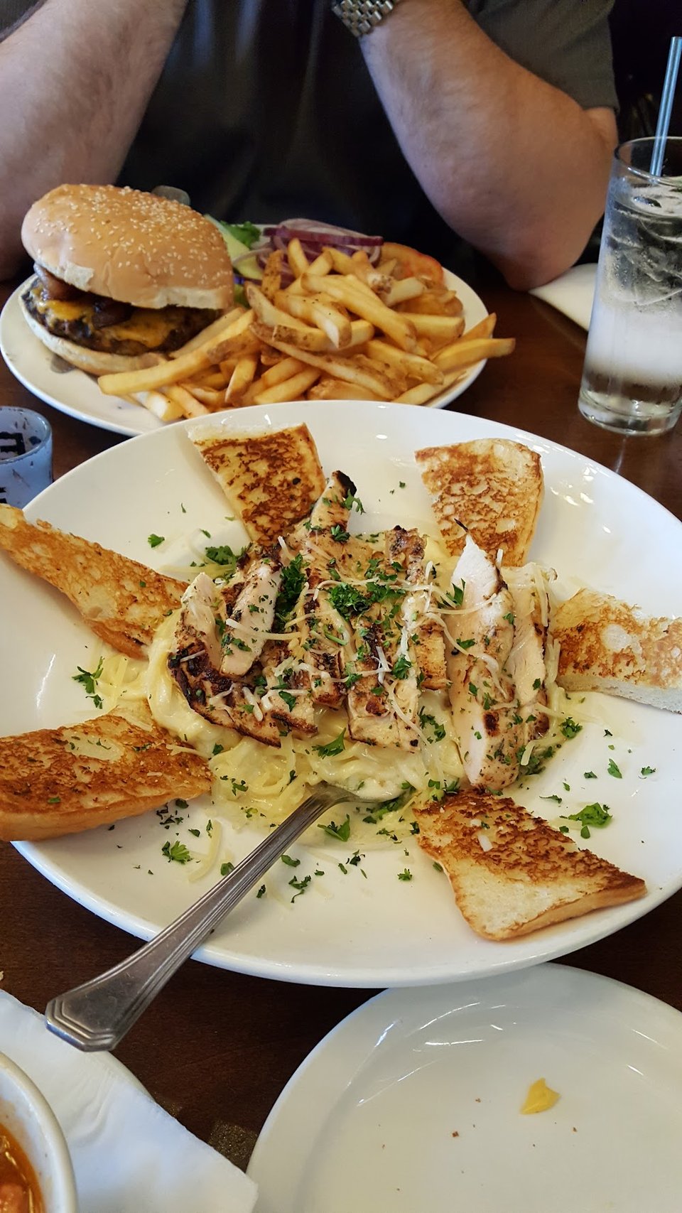 Restaurant menu featuring sandwiches, pasta, and dessert.